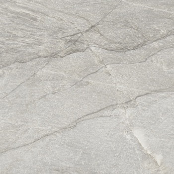 Matte gray porcelain paving tile with primordial quartzite texture, evoking serene depth for modern outdoor and indoor spaces.