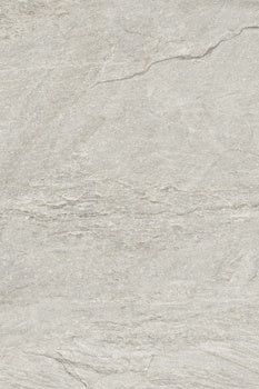 Rectified matte porcelain paving tile in warm beige with primordial quartzite texture, evoking serene depth for intimate outdoor spaces.