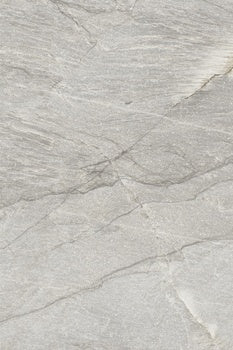 Luxurious matte gray porcelain paving tile with primordial quartzite essence, exuding serene depth for harmonious outdoor and intimate spaces.