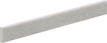 Soft gray porcelain bullnose trim with a matte, textured finish, blending modern elegance with playful sophistication for seamless transitions.