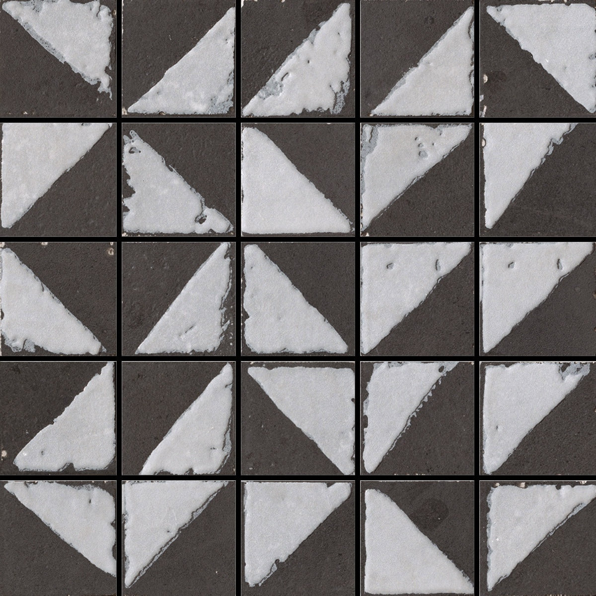 Matte black porcelain tile with a warm, handcrafted charm, evoking timeless elegance and earthy sophistication in a refined contemporary space.
