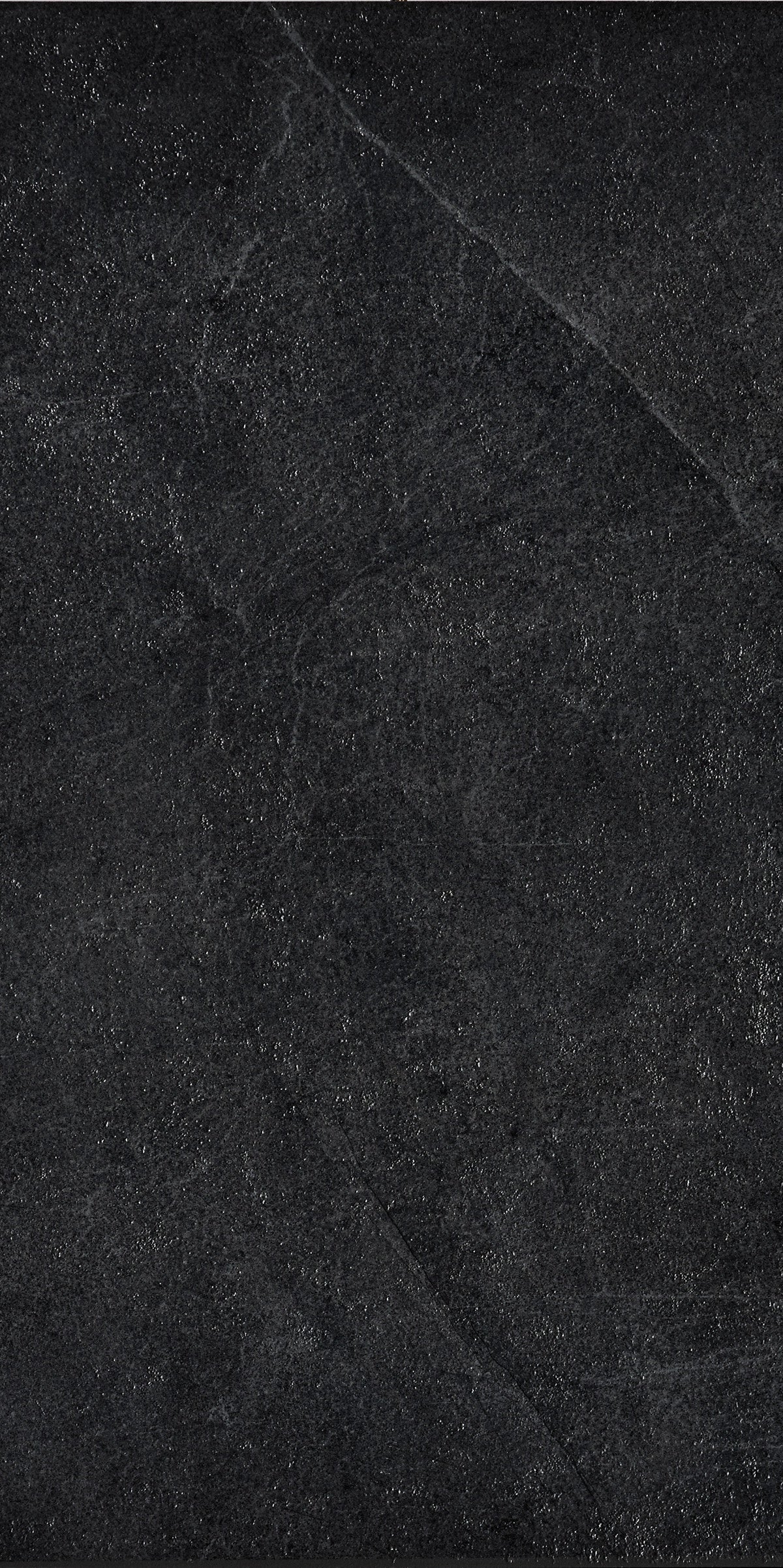 Dark grey rectified porcelain tile with a smooth matte finish, embodying minimalist sophistication and urban industrial chic.