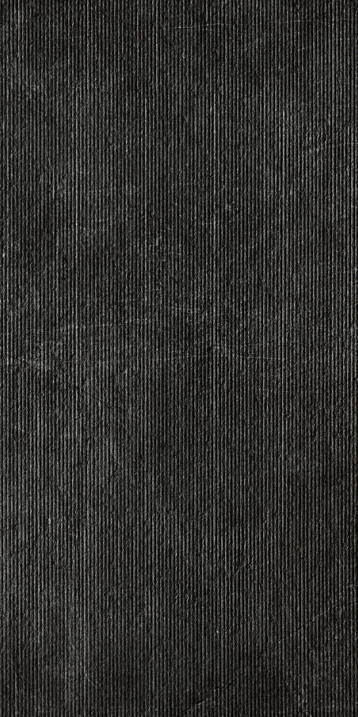Dark gray porcelain tile with a refined matte finish, embodying minimalist elegance and high-tech sophistication for modern interiors.