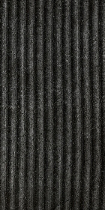 Dark gray porcelain tile with a refined matte finish, embodying minimalist elegance and high-tech sophistication for modern interiors.