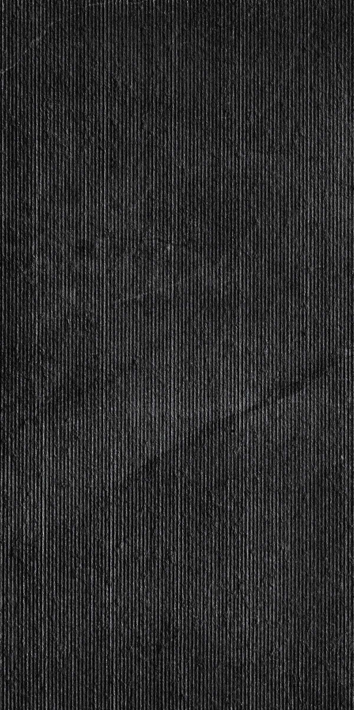 Dark grey rectified porcelain tile with a smooth matte finish, embodying minimalist sophistication and understated urban elegance.