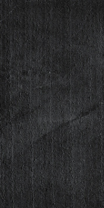 Dark grey rectified porcelain tile with a smooth matte finish, embodying minimalist sophistication and understated urban elegance.