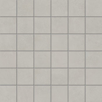 Matte silver porcelain mosaic tiles with a soft plaster-like texture, exuding minimalist elegance and serene luxury for refined interiors.