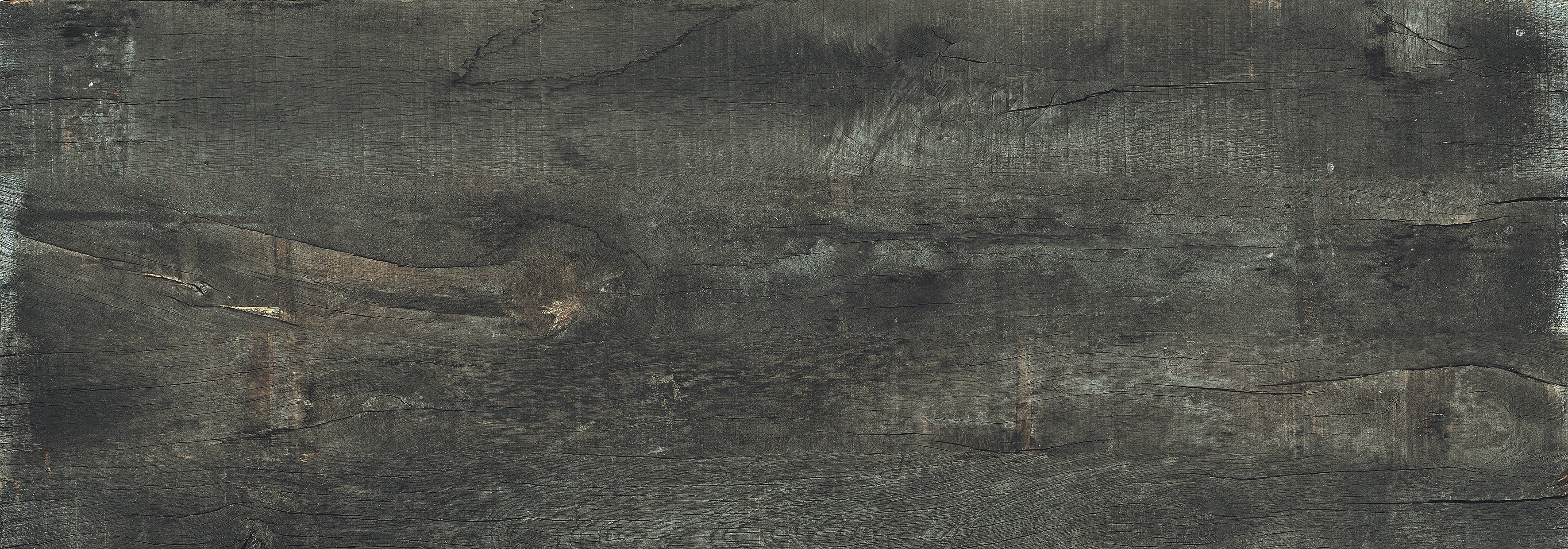Sun-dried wood-look porcelain tile with deep black-brown tones and a textured matte finish, exuding rustic elegance and warmth.