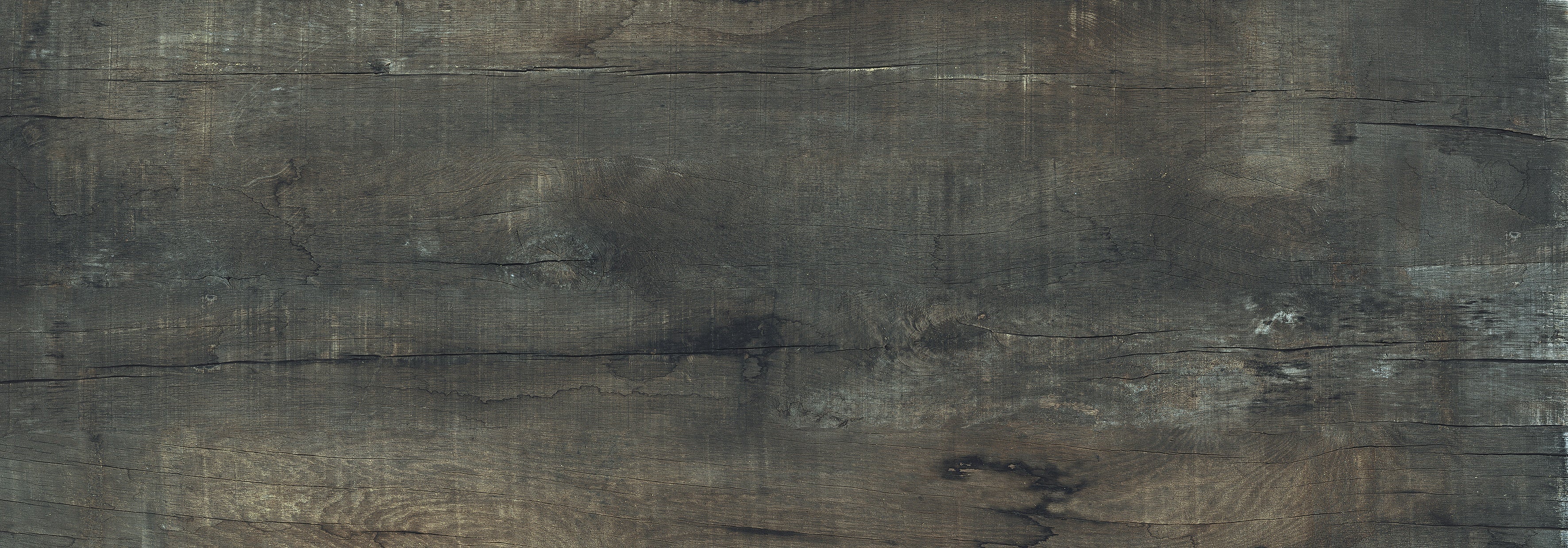 Sun-dried wood-look porcelain plank with deep brown and black grain, matte 3D texture, and rectified edges for seamless luxury flooring.