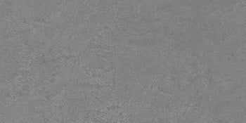 Sleek matte porcelain wall tile in soft middle grey, embodying minimalist elegance with a refined plaster-like texture.