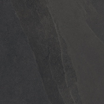 Black porcelain bullnose trim with soft slate texture, rippled like weathered stone, for seamless organic elegance in modern interiors.