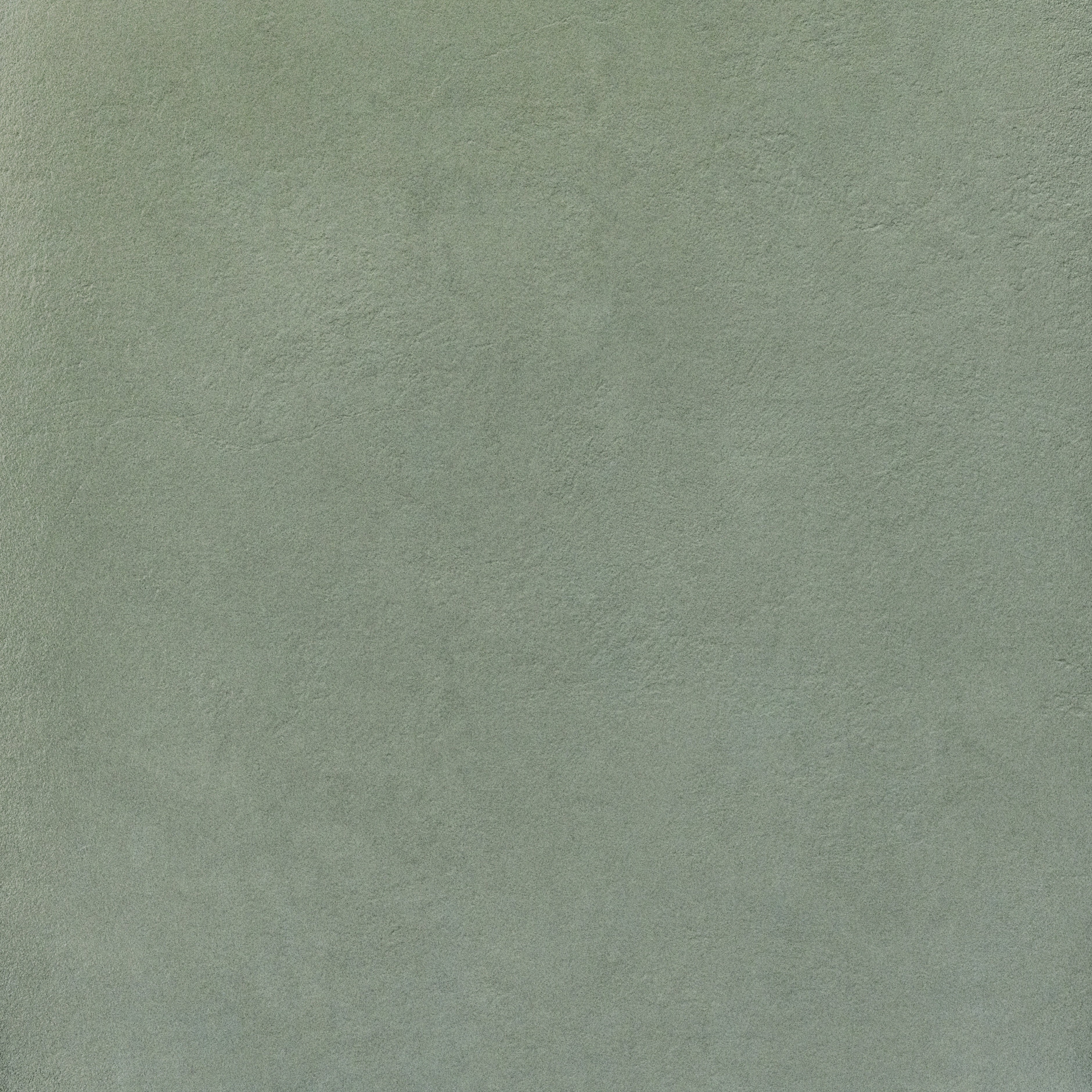 Industrial-chic concrete-look porcelain tile with raw, textured matte surface in deep gray, exuding brutalist elegance and urban durability.