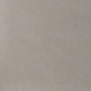 Dark gray concrete-look porcelain tile with a raw, textured matte finish, embodying industrial elegance and brutalist strength.