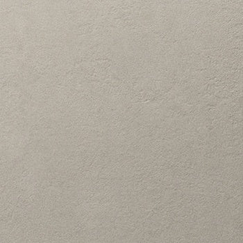 Large-format matte gray porcelain tile with raw concrete texture and industrial elegance, embodying brutalist strength and timeless minimalism.