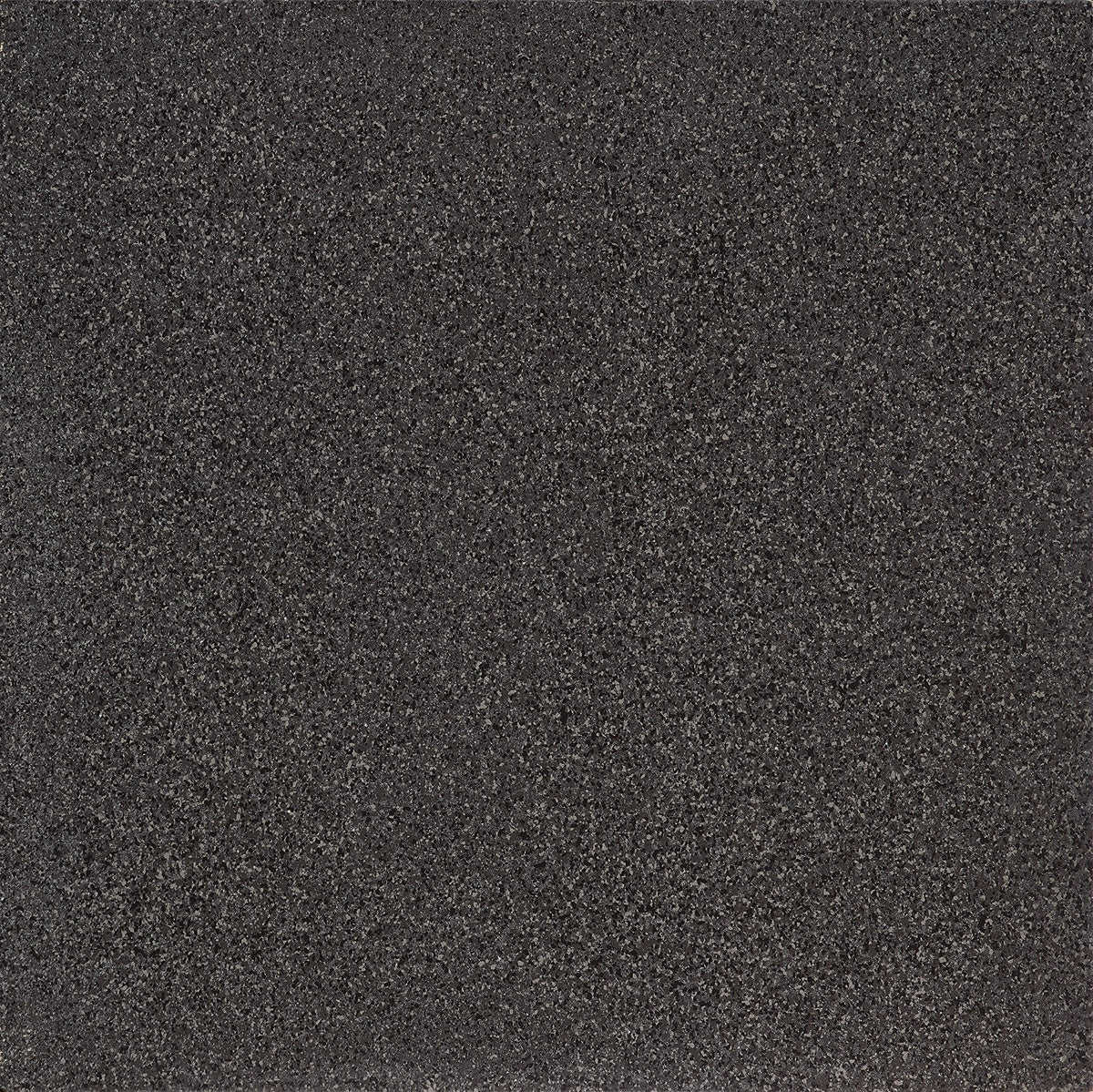 Black terrazzo porcelain tile with bold concrete-inspired chips and flakes, exuding timeless elegance and sophisticated drama.