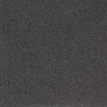 Black terrazzo porcelain tile with bold concrete-inspired chips and flakes, exuding timeless elegance and sophisticated drama.