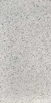 Porcelain terrazzo tile with glossy white surface and elegant chips, embodying timeless luxury for sophisticated interiors.
