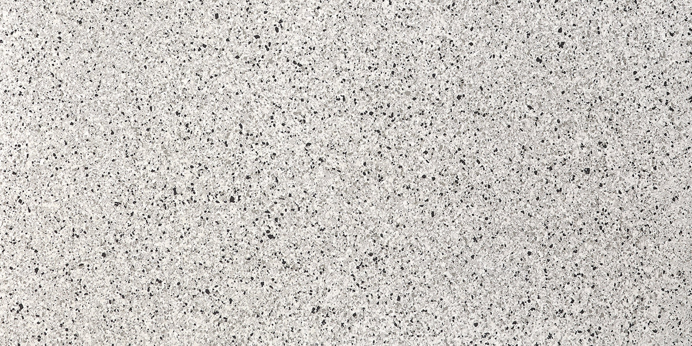 Large-format porcelain tile with a refined terrazzo look, soft white base and delicate chips, embodying timeless minimalist luxury.