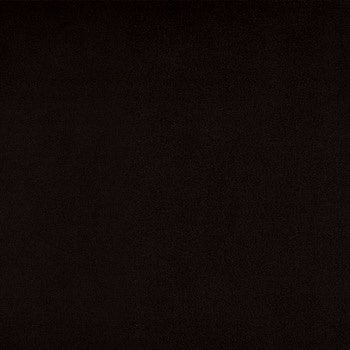 Black porcelain floor tile with matte finish and subtle chips, exuding timeless elegance and bold modern luxury in a grand square format.