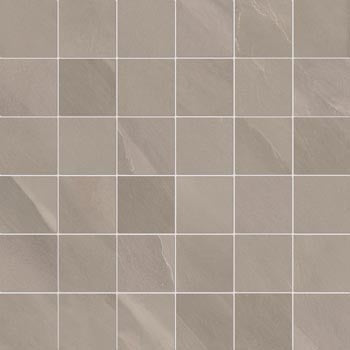 Matte gray porcelain mosaic with volcanic slate texture, rectified edges, and an organic straight-stack pattern.