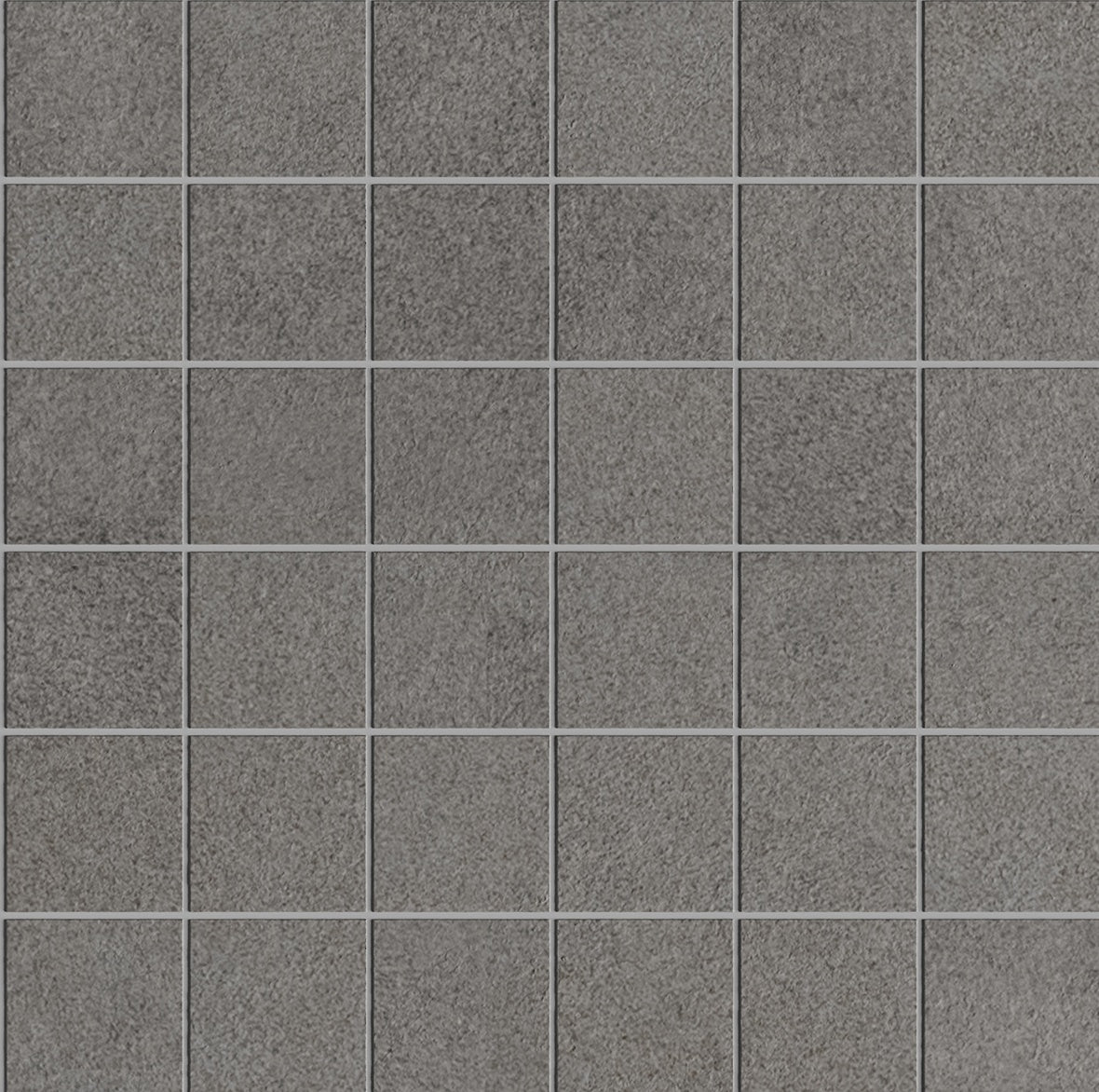 Dark gray concrete-look porcelain mosaic with raw industrial texture, matte finish, and rugged elegance for bold, timeless spaces.