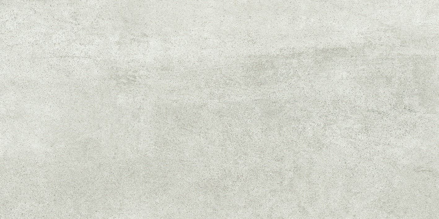 Matte white porcelain tile with soft 3D texture, evoking refined concrete in a minimalist, industrial-chic design.
