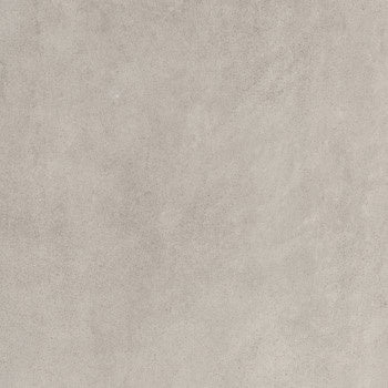 Matte silver-gray porcelain tile with soft 3D texture, evoking refined industrial elegance in a timeless concrete aesthetic.