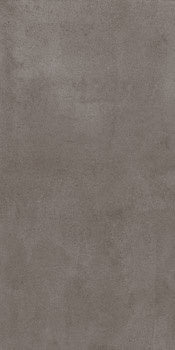 Luxurious dark gray porcelain tile with a soft, bush-hammered concrete texture, exuding timeless industrial elegance and refined serenity.