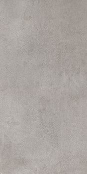 A matte grey porcelain tile with a soft, bush-hammered texture, evoking refined industrial elegance and timeless concrete allure.