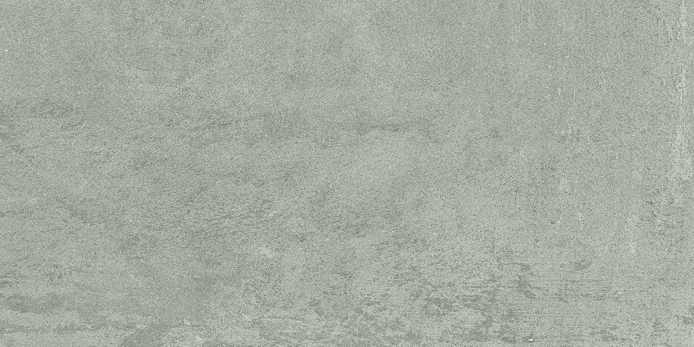 Matte silver-gray porcelain tile with a soft bush-hammered texture, evoking timeless industrial elegance and serene concrete warmth.