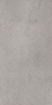 Bush-hammered gray porcelain tile with a soft matte concrete texture, exuding industrial elegance and timeless sophistication.