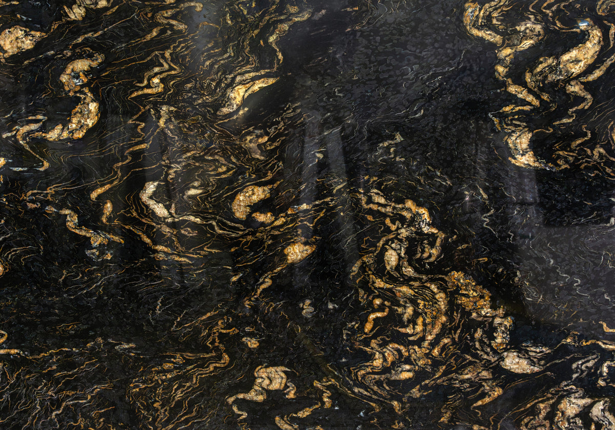 Granite Slabs Titanium Gold granite slabs, top-down product view. Premium granite for floors and walls.