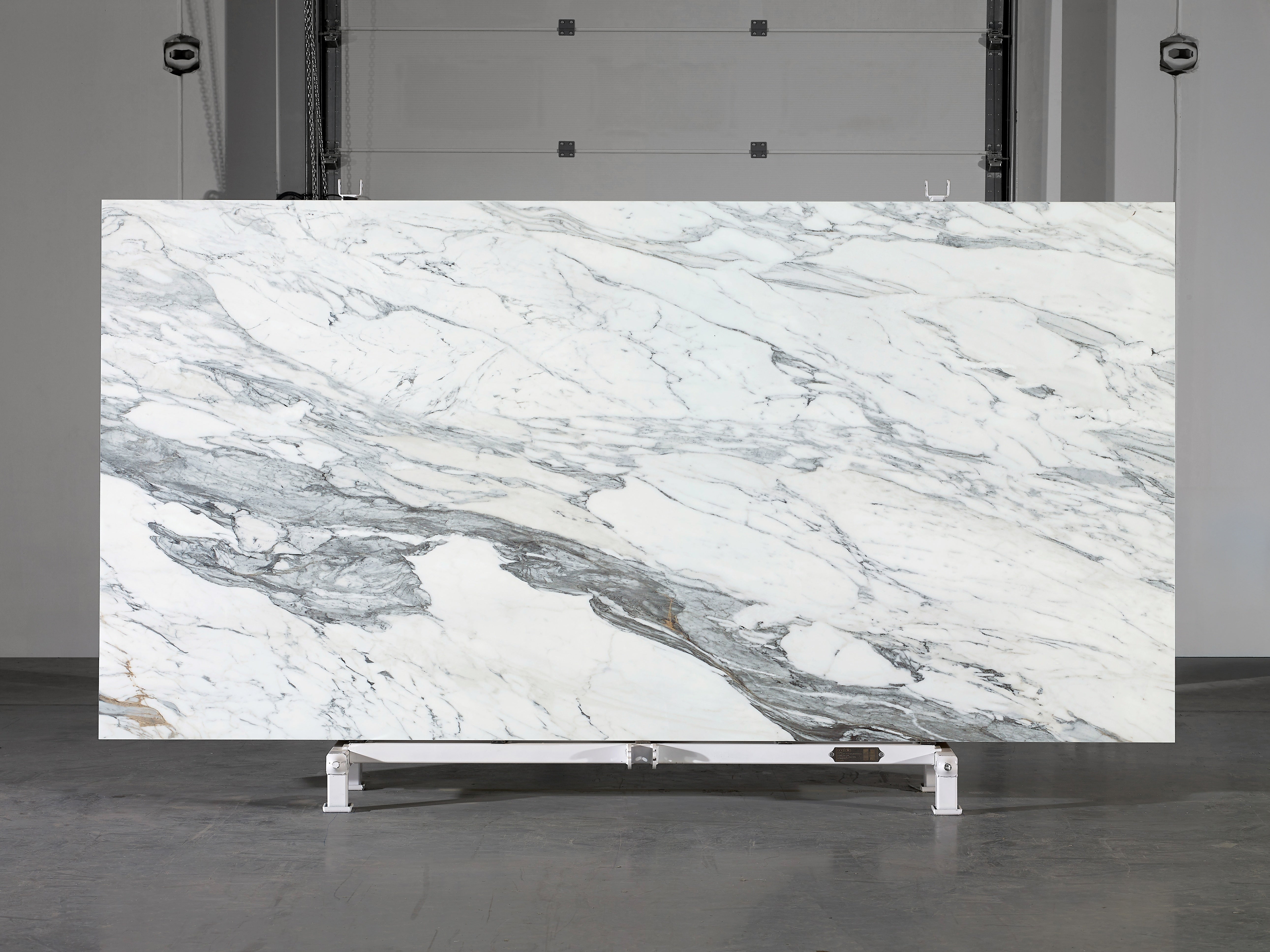 Majesto Calacatta Corchia sintered stone slabs by Anatolia, top-down product view, 64"×127"×15/32" size. Turkish sintered stone for floors and walls.
