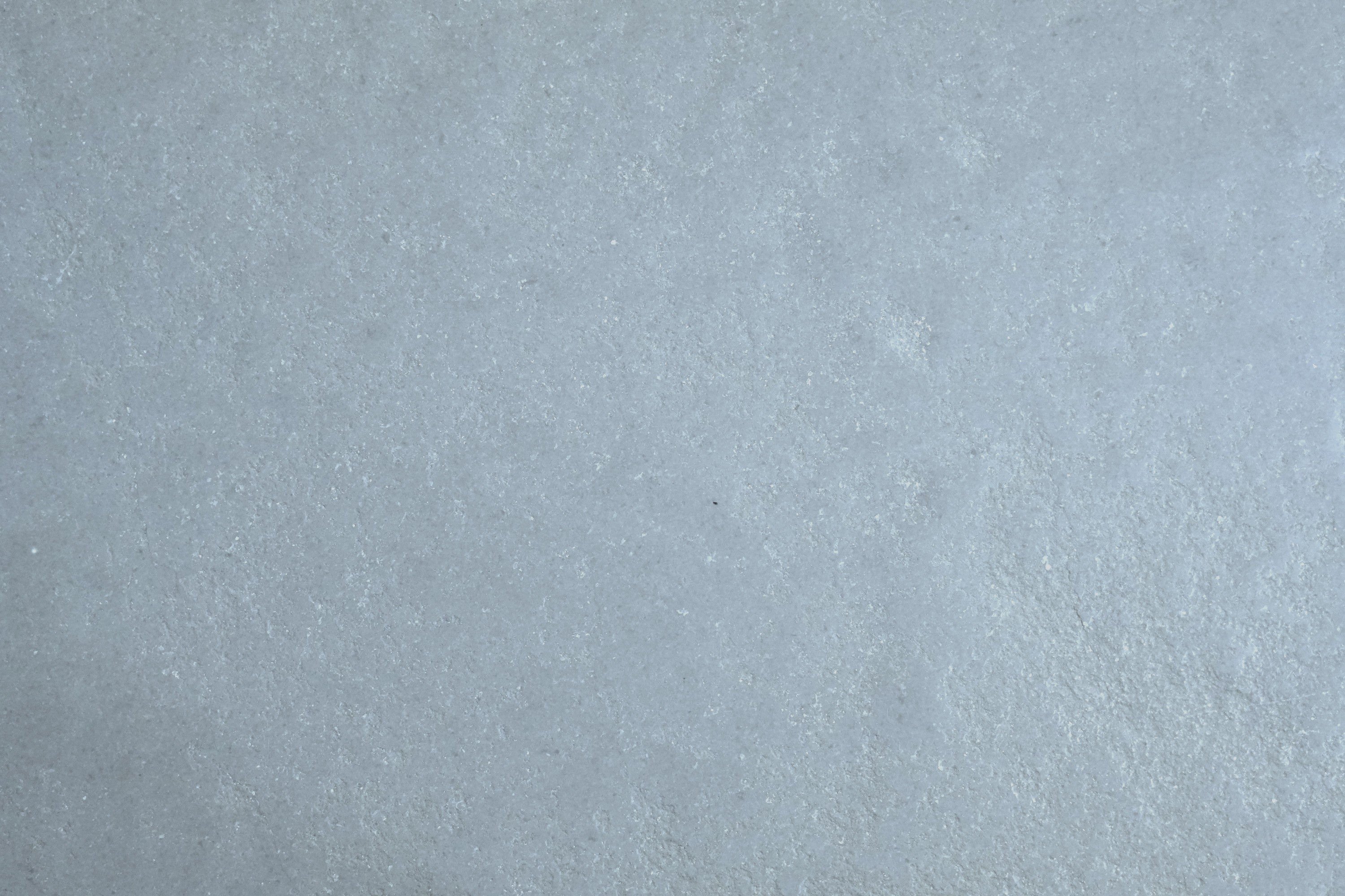 Saint Jean Grey limestone field tile, top-down product view, 16"×24"×3/4" size. Premium limestone for floors and walls.