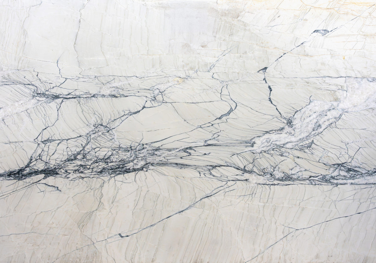 Quartzite Slabs Calacatta Giotto Leather quartzite slabs, top-down product view. Premium quartzite for floors and walls.