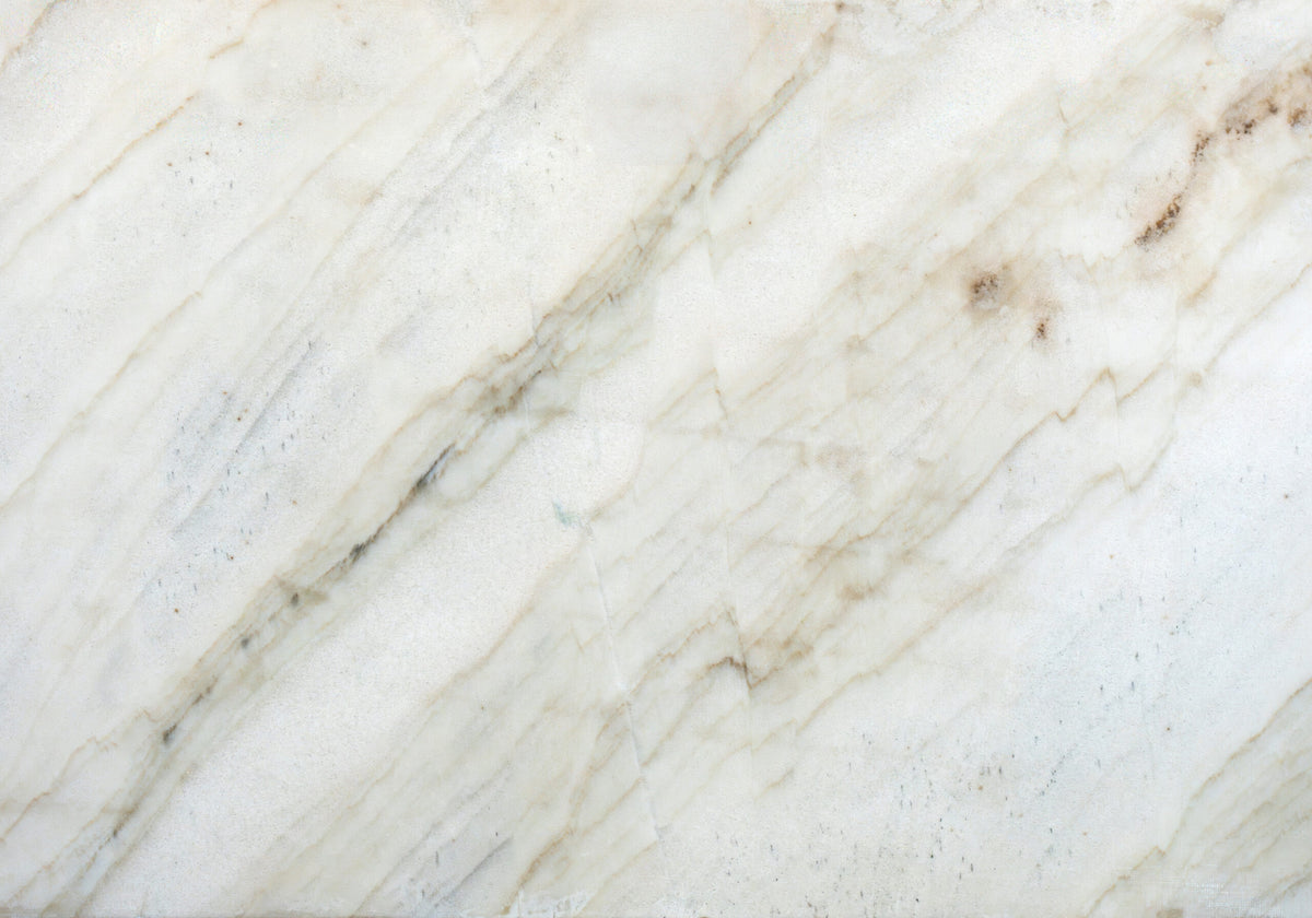 Designer's Choice Sky Gold quartzite slabs, top-down product view. Premium quartzite for floors and walls.