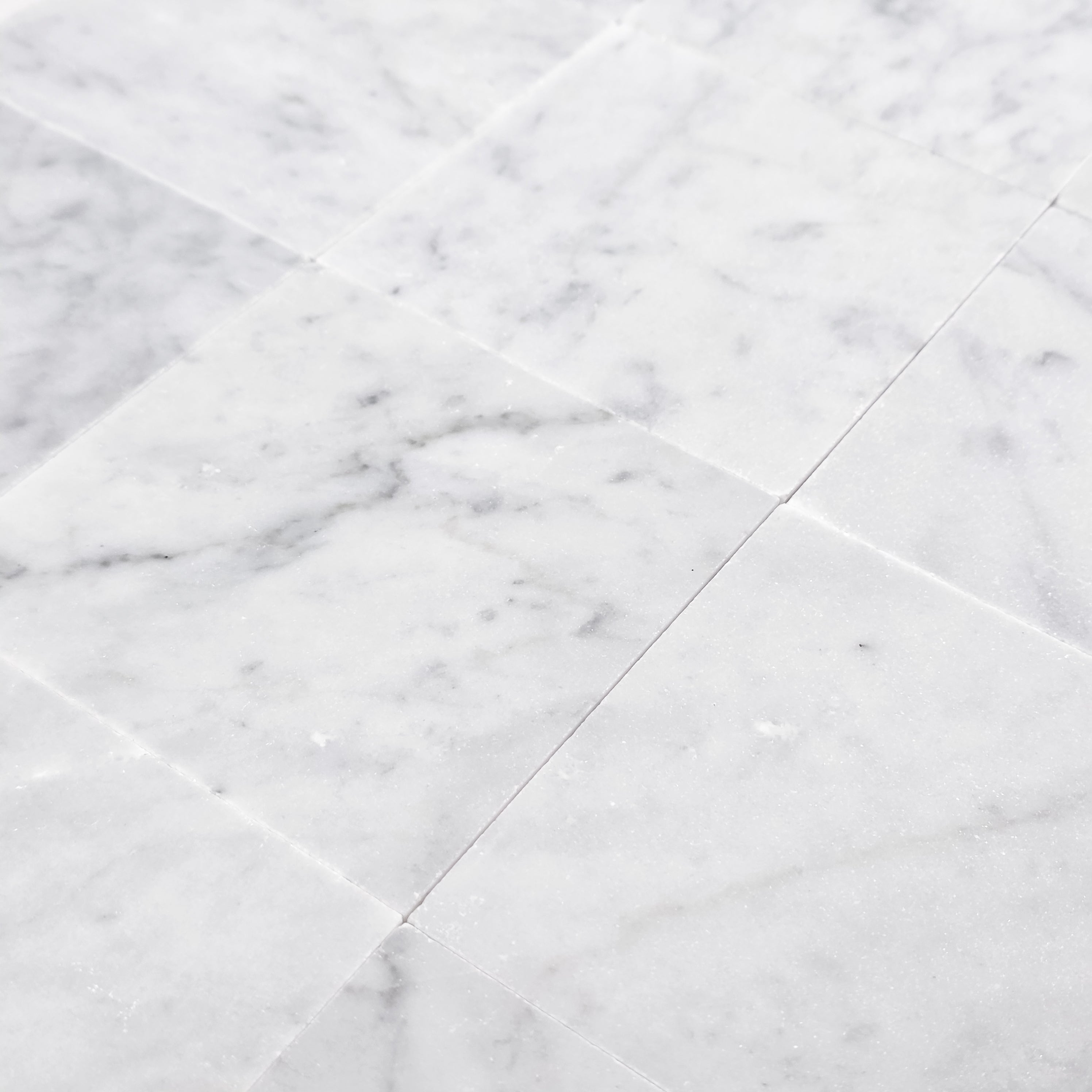 Elon Tile Bianco Carrara Field Tile tile arrangement — available at Surface Group