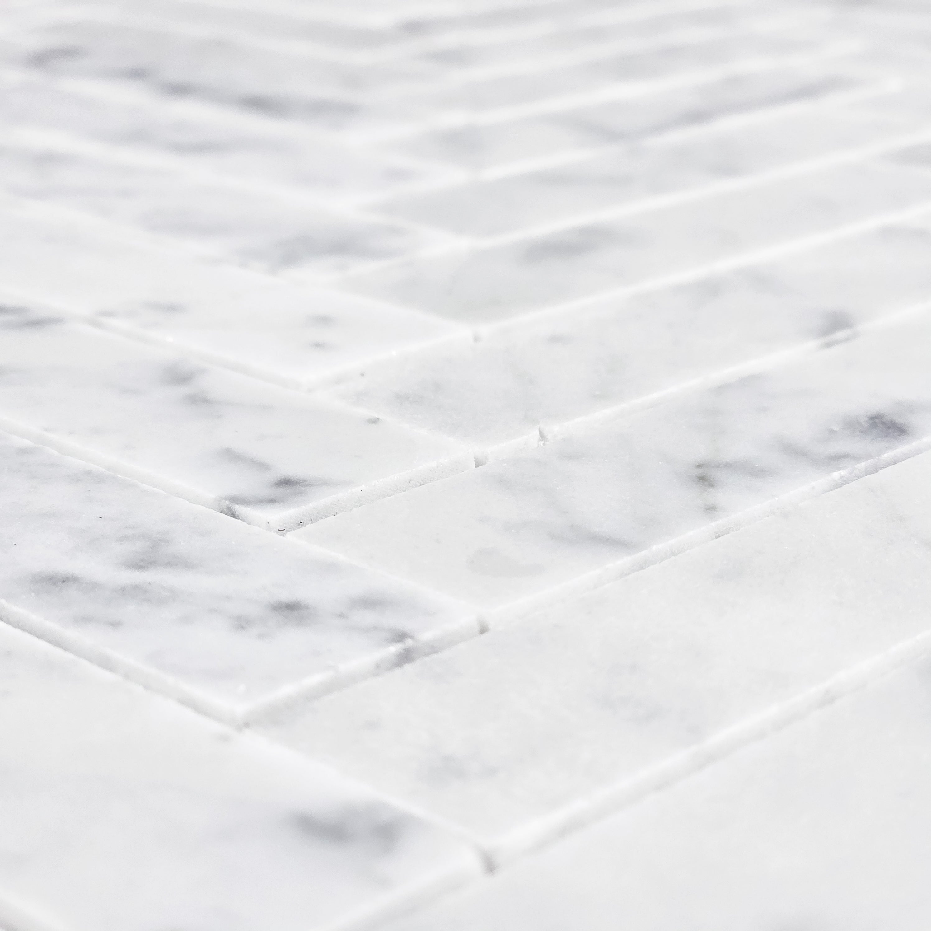 Elon Tile Herringbone tile arrangement — available at Surface Group