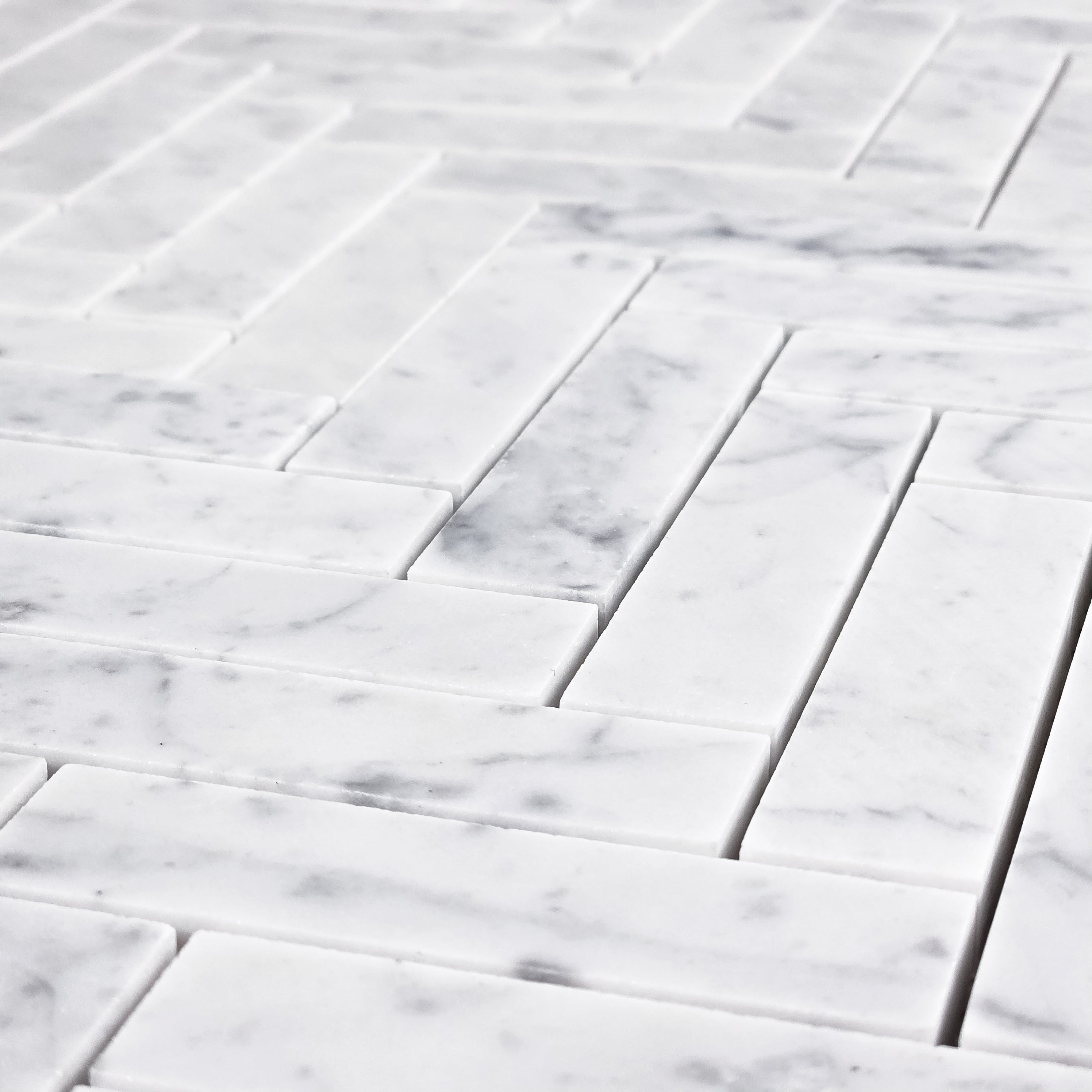Elon Tile Herringbone tile arrangement — available at Surface Group