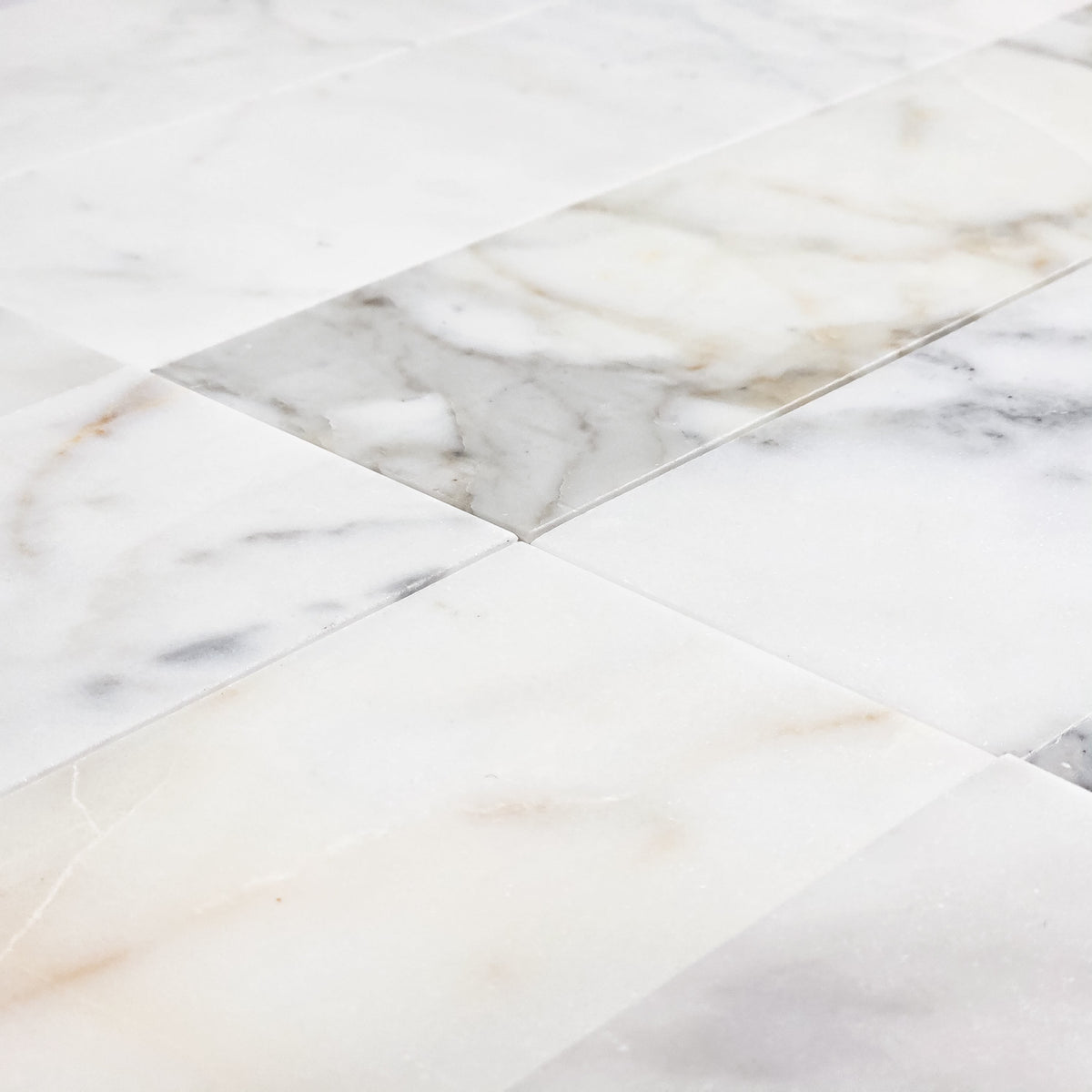 Elon Tile Calacatta Gold Field Tile tile arrangement — available at Surface Group