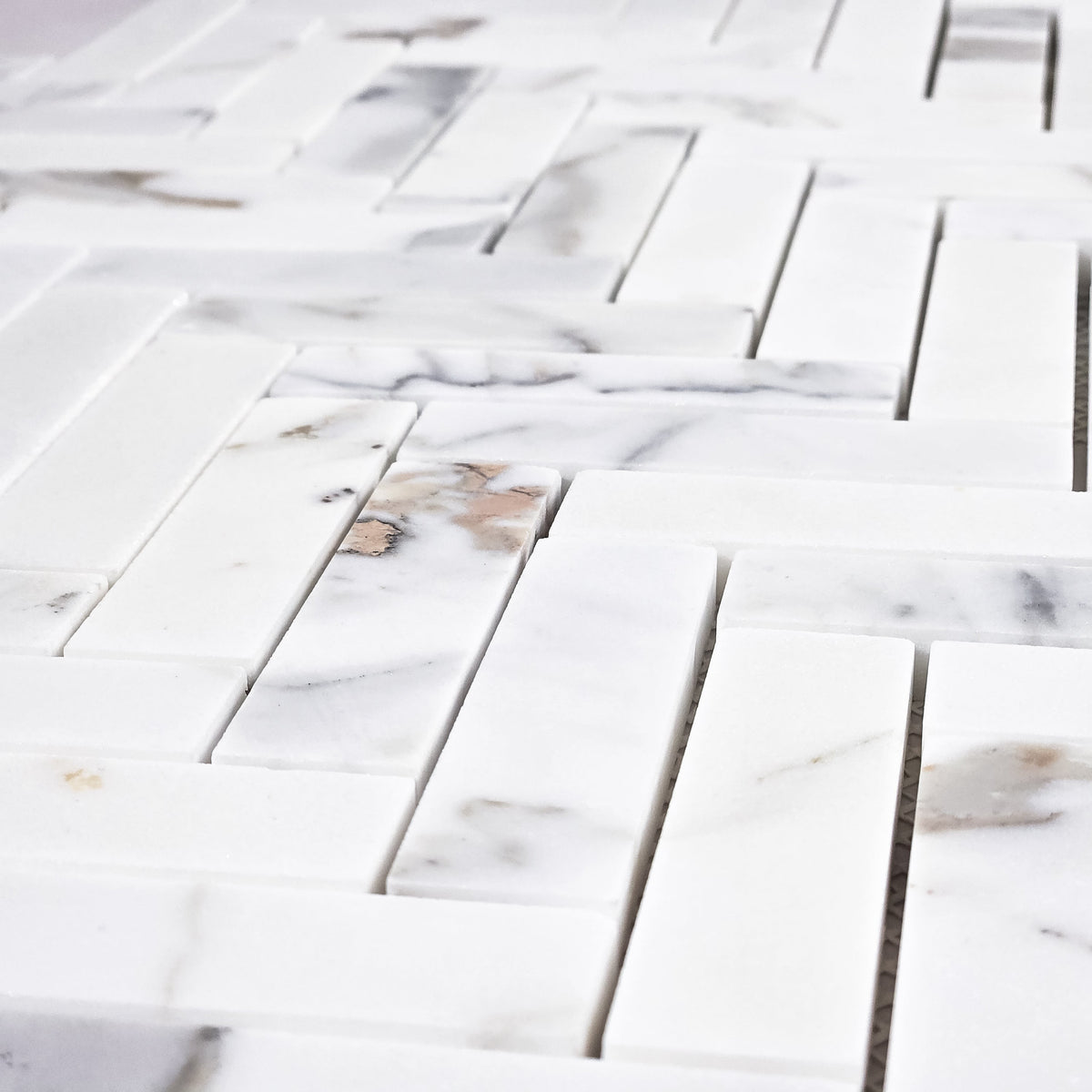 Elon Tile Herringbone tile arrangement — available at Surface Group