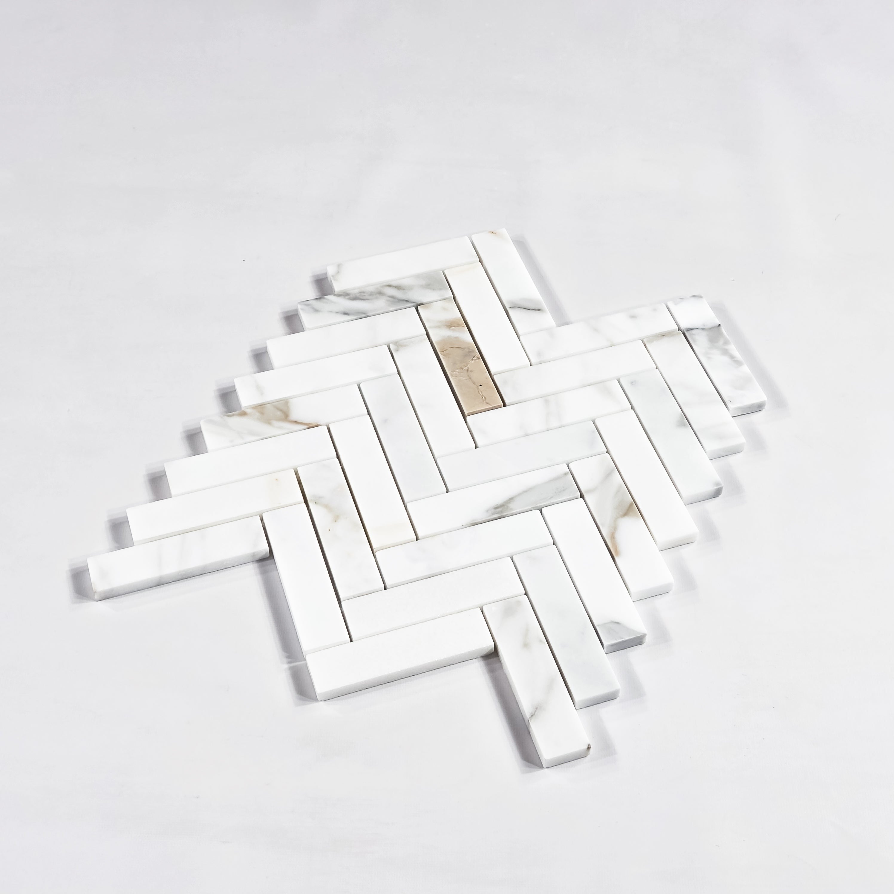 Elon Tile Herringbone tile β available at Surface Group