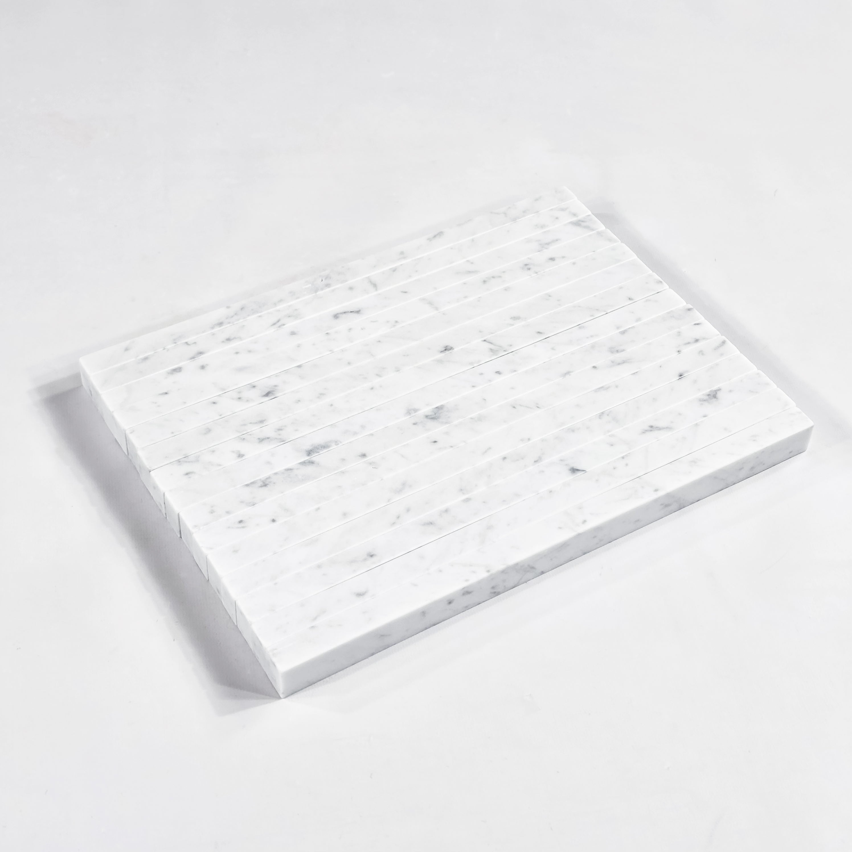 Elon Tile Flat Liner tile arrangement — available at Surface Group