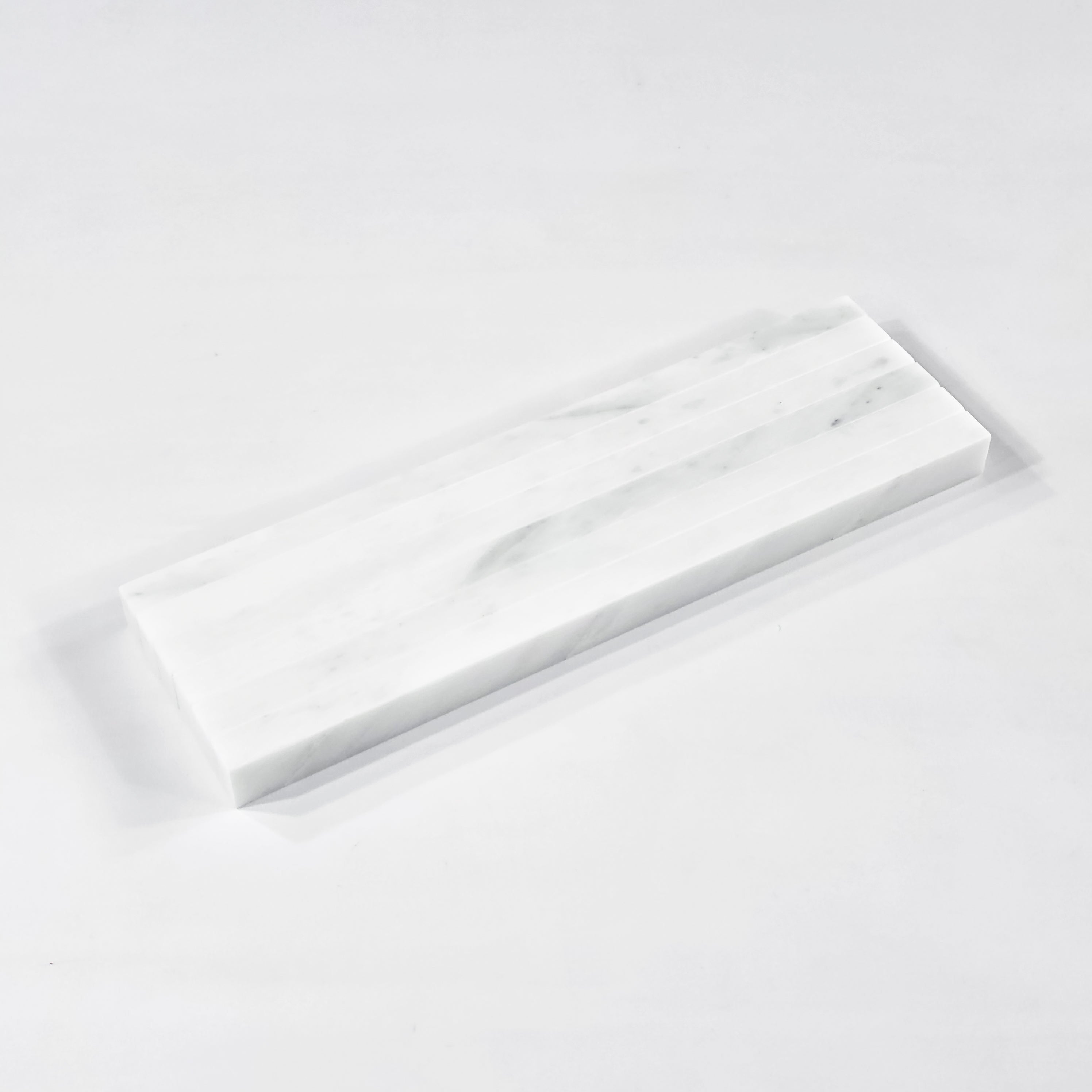 Elon Tile Flat Liner tile close-up view — available at Surface Group