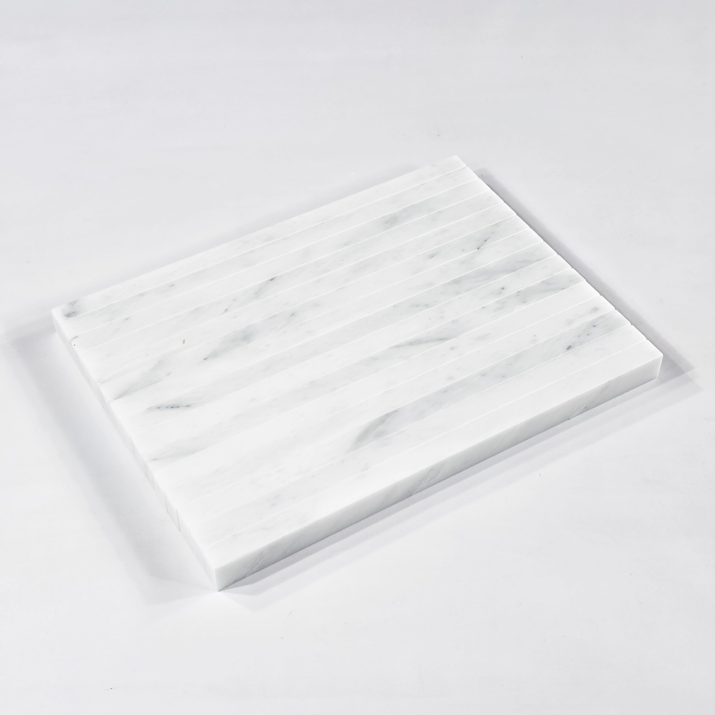 Elon Tile Flat Liner tile arrangement — available at Surface Group