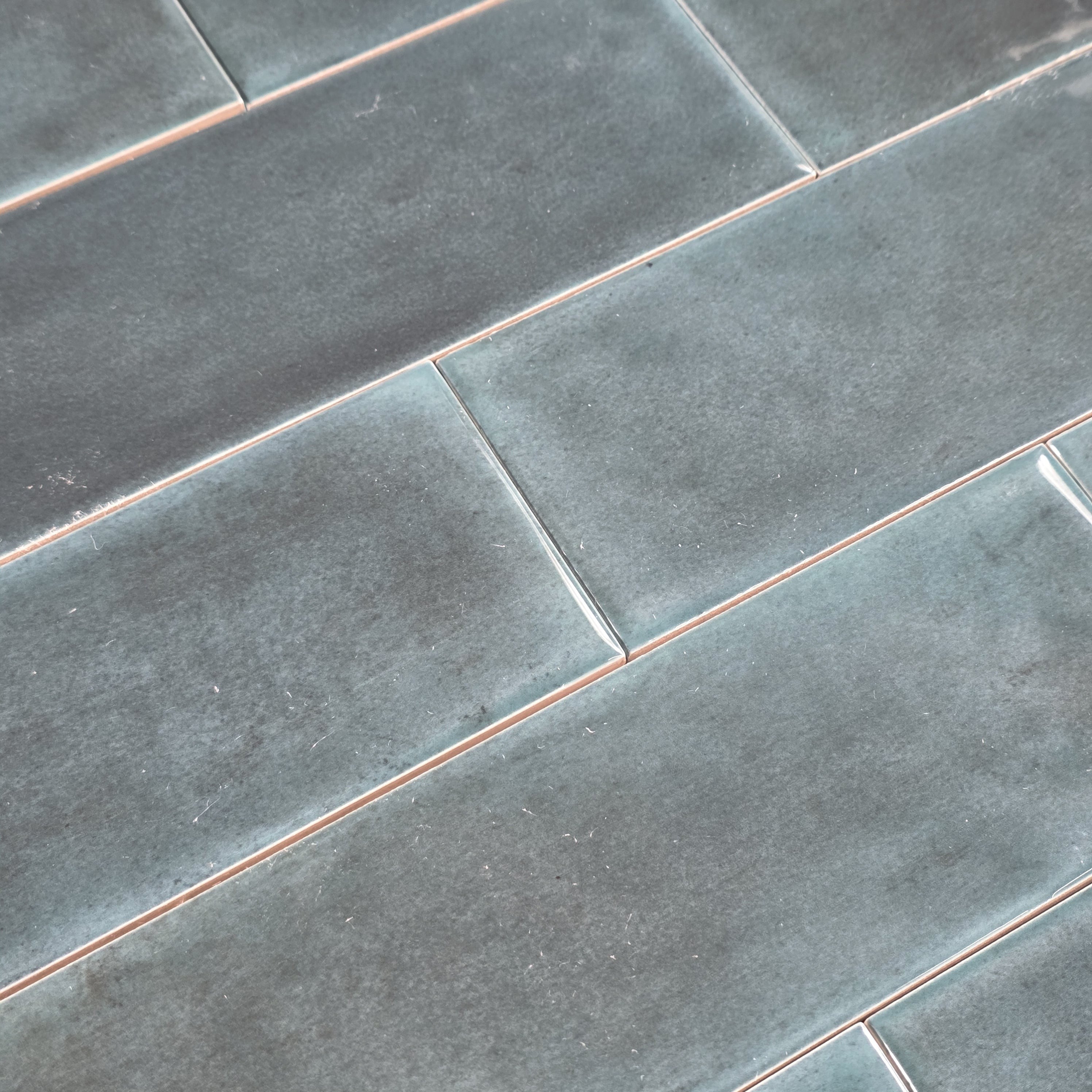 Elon Tile Opal Teal tile arrangement — available at Surface Group