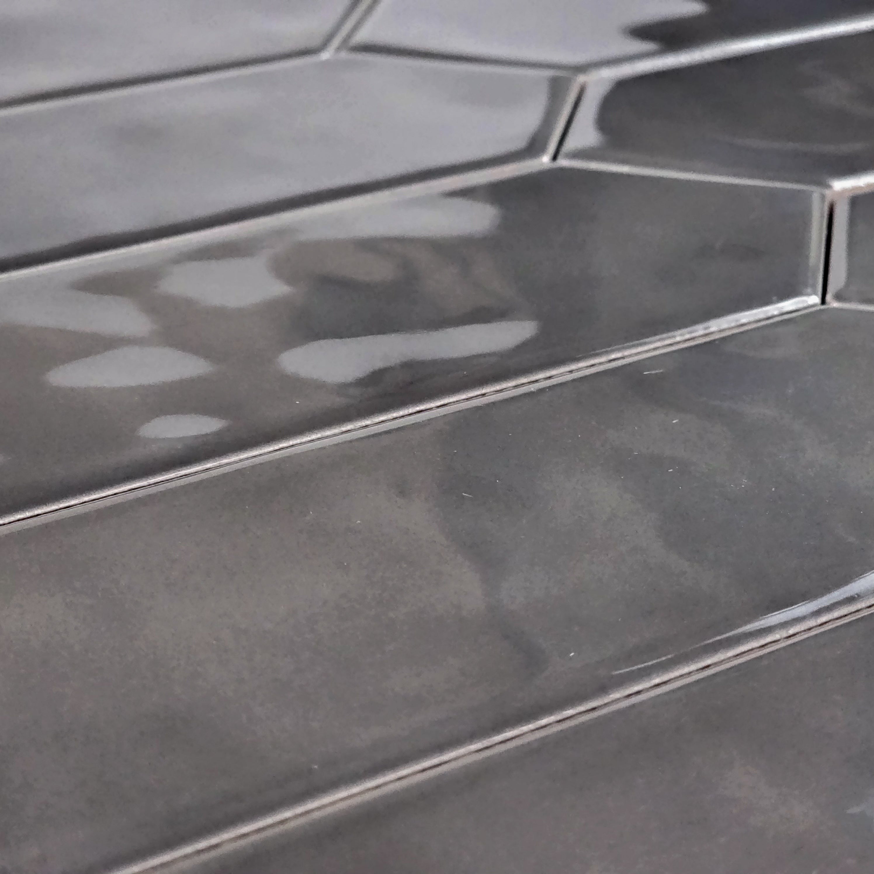 Elon Tile Optics Anthracite tile arrangement — available at Surface Group