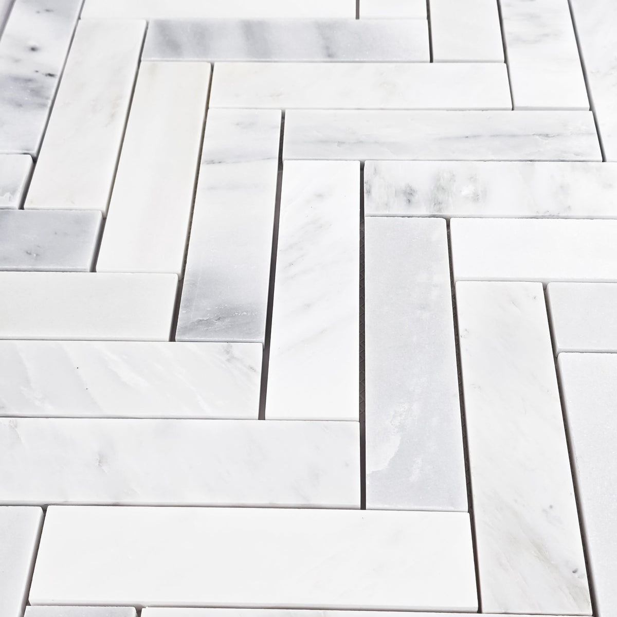 Elon Tile Herringbone tile arrangement — available at Surface Group