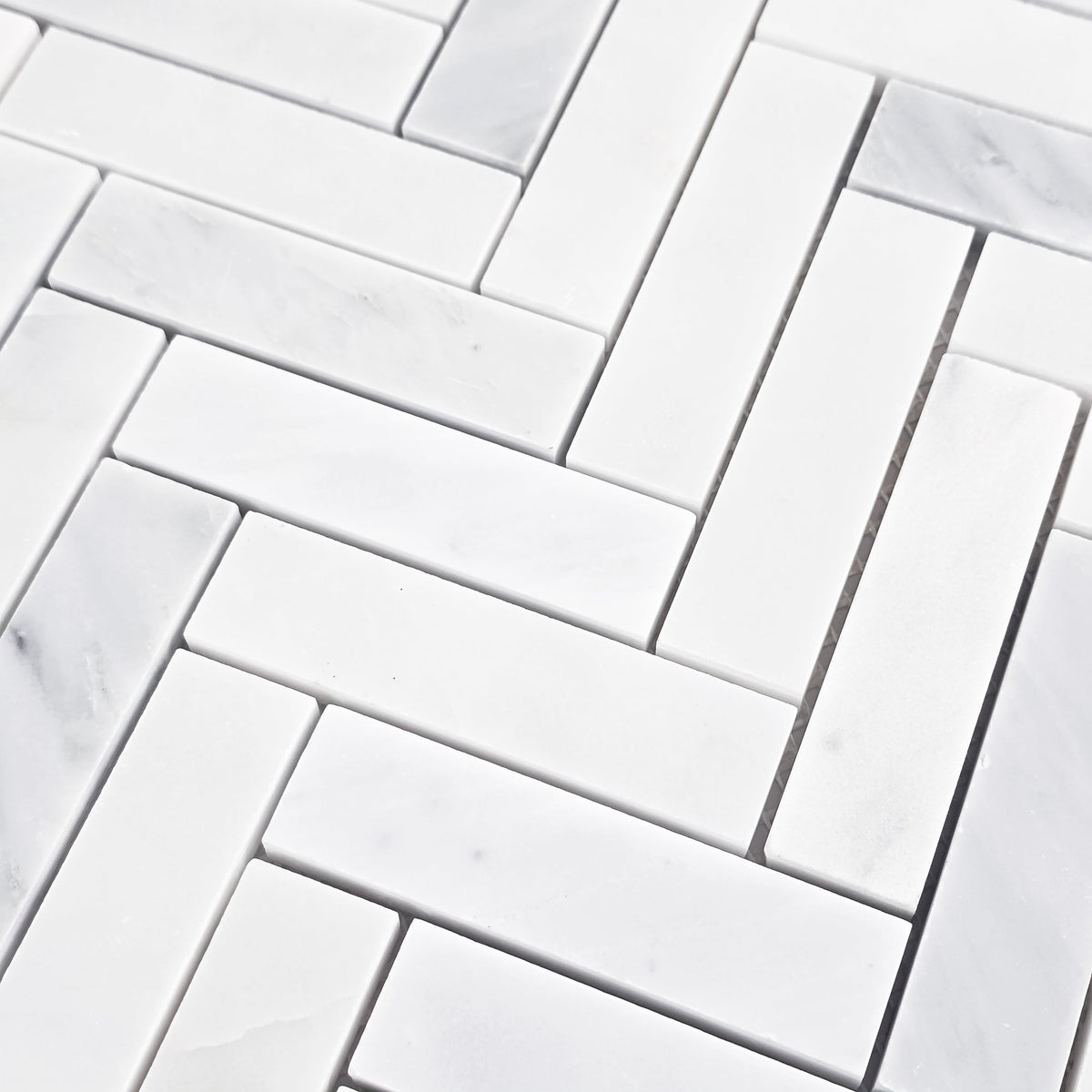 Elon Tile Herringbone tile arrangement — available at Surface Group