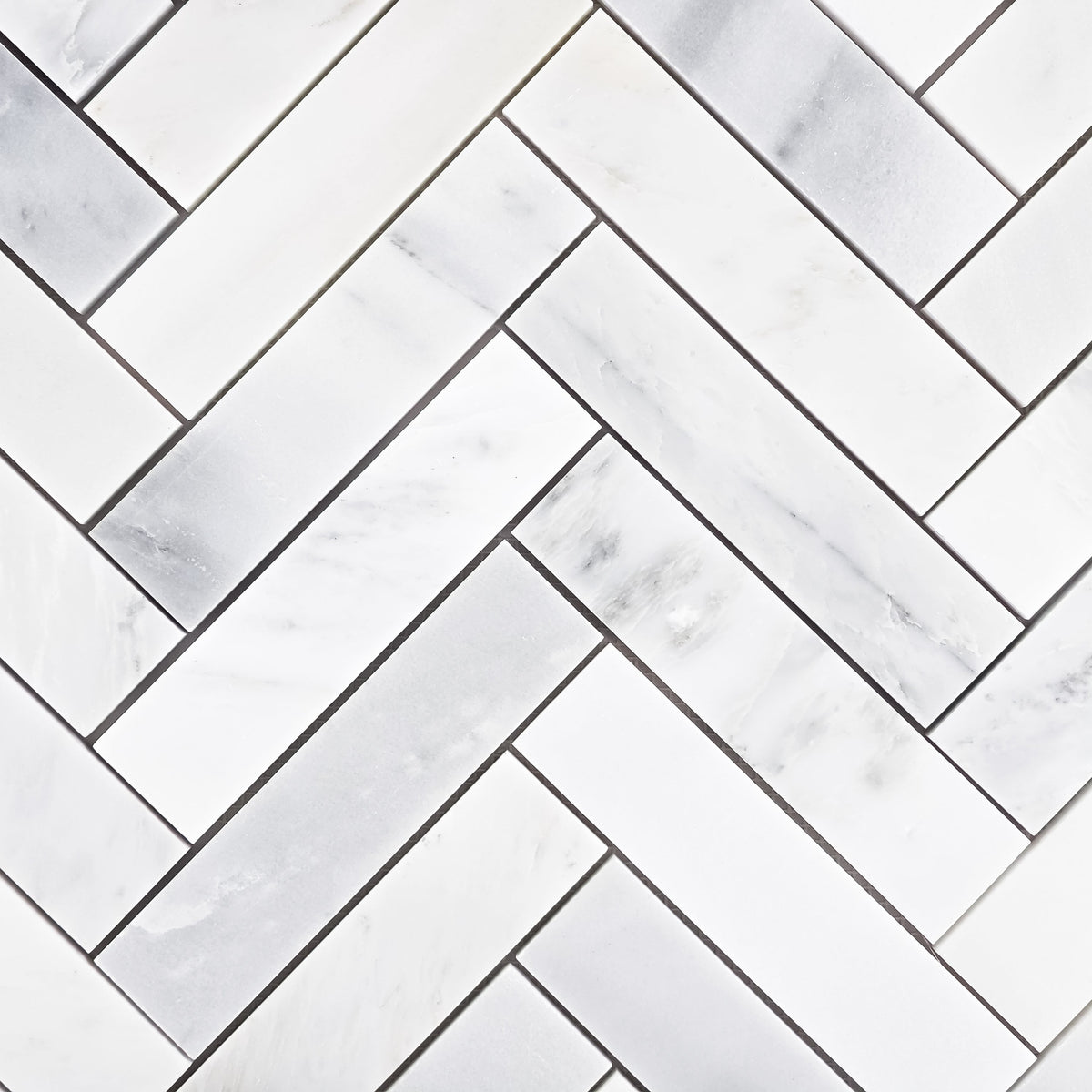 Elon Tile Herringbone tile pattern swatch β available at Surface Group